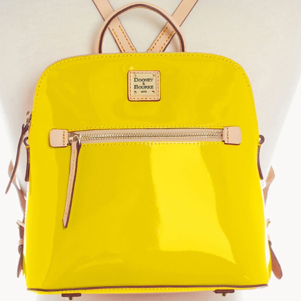 This bag is fairly new. Small yellow backpack.